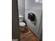 Small bathroom featuring a toilet and wall-mounted paper towel dispenser at 957 Astor Ave, Forest Park, GA 30297