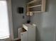 Small bathroom featuring a white vanity and open shelving, complemented by neutral walls at 957 Astor Ave, Forest Park, GA 30297