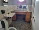 Bathroom includes a sink with built-in vanity and a tiled floor at 957 Astor Ave, Forest Park, GA 30297
