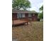 The backyard features a wood deck and backyard lawn at 957 Astor Ave, Forest Park, GA 30297