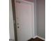 A white interior door against gray walls and hardwood floors at 957 Astor Ave, Forest Park, GA 30297