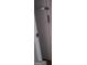Detail shot of a weathered white door with tarnished hardware at 957 Astor Ave, Forest Park, GA 30297