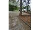Property exterior view showing its outdoor space with mature trees and a fence line at 957 Astor Ave, Forest Park, GA 30297