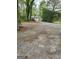 Exterior view of a home with a charming yard and mature trees, capturing its curb appeal at 957 Astor Ave, Forest Park, GA 30297