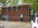 Exterior shot of the building with a brick facade and parking in the front at 957 Astor Ave, Forest Park, GA 30297