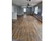 Spacious living room features hardwood floors, neutral paint, and multiple windows for lots of natural light at 957 Astor Ave, Forest Park, GA 30297