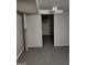 Room with gray walls and gray painted floors with a door to another room at 957 Astor Ave, Forest Park, GA 30297