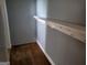 A simple room with a shelf and rack space, perfect for storage and organization solutions at 957 Astor Ave, Forest Park, GA 30297
