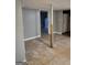 Room with gray walls and damaged tile flooring, featuring an interior view at 957 Astor Ave, Forest Park, GA 30297