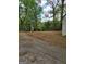 Spacious yard with lush greenery and a shed, offering privacy and storage solutions at 957 Astor Ave, Forest Park, GA 30297