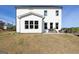 Large backyard with a patio and modern outdoor furniture, ideal for entertaining and enjoying nature at 602 Belshire Dr, Acworth, GA 30102
