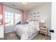 Airy bedroom featuring butterfly decor, floral bedding, and soft pink accents for a cozy feel at 602 Belshire Dr, Acworth, GA 30102
