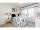 Bright bedroom with large windows, a decorative comforter, and black and white accents at 602 Belshire Dr, Acworth, GA 30102