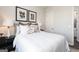 Cozy bedroom showcasing a comfortable bed with decorative pillows and contemporary artwork at 602 Belshire Dr, Acworth, GA 30102