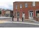 A red brick building features vintage architectural details, complemented by a textured brick sidewalk and bollard lights at 602 Belshire Dr, Acworth, GA 30102