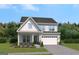 Charming two-story home featuring a two-car garage, landscaped yard and Craftsman-style architecture at 602 Belshire Dr, Acworth, GA 30102