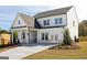 Attractive two-story new construction home with a covered porch, craftsman features and professional landscaping at 602 Belshire Dr, Acworth, GA 30102