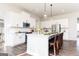 Bright and modern kitchen with white cabinetry, a central island, and stainless steel appliances is pleasing to the eye at 602 Belshire Dr, Acworth, GA 30102