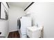 Modern laundry room with sleek appliances, sink, and stylish black and white decor for convenience at 602 Belshire Dr, Acworth, GA 30102
