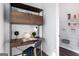 Functional office space features a compact desk, organized shelves, and a view into an organized pantry at 602 Belshire Dr, Acworth, GA 30102