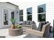 Stylish patio with modern wicker furniture and a round coffee table, perfect for outdoor relaxation at 602 Belshire Dr, Acworth, GA 30102
