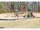 A well-maintained playground with swings and slides offers outdoor fun for families in a natural setting at 602 Belshire Dr, Acworth, GA 30102