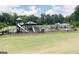 A large fenced playground in the community features shade structures and various activities at 602 Belshire Dr, Acworth, GA 30102