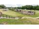 Playground on manicured green space in community, with stairs in the foreground at 602 Belshire Dr, Acworth, GA 30102