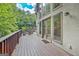 Expansive back deck, ideal for entertaining, offering outdoor dining and relaxing views of nature at 1214 Weatherstone Way, Peachtree City, GA 30269