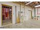 Unfinished basement area with a utility sink and access to additional storage space at 1214 Weatherstone Way, Peachtree City, GA 30269