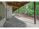 Covered concrete patio area underneath the deck; part of the walkout basement at 1214 Weatherstone Way, Peachtree City, GA 30269