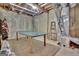 Unfinished basement space featuring a ping pong table and exposed ductwork and ceiling at 1214 Weatherstone Way, Peachtree City, GA 30269