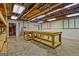 Unfinished basement featuring large workbench, ready for customization and storage needs at 1214 Weatherstone Way, Peachtree City, GA 30269