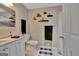 Bathroom boasts a white vanity, toilet and tub/shower combination at 1214 Weatherstone Way, Peachtree City, GA 30269