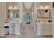 Spacious bathroom featuring separate vanities with white cabinets at 1214 Weatherstone Way, Peachtree City, GA 30269