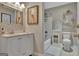 Bathroom with white vanity, large framed mirror, and tiled floor at 1214 Weatherstone Way, Peachtree City, GA 30269