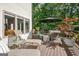 Inviting outdoor deck area with wicker furniture, lounge chairs and wooded views at 1214 Weatherstone Way, Peachtree City, GA 30269