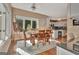 Bright dining room featuring a wooden table set, large windows, and hardwood floors at 1214 Weatherstone Way, Peachtree City, GA 30269