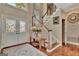 Inviting foyer with beautiful hardwood floors and staircase with elegant railings, creating a warm ambiance at 1214 Weatherstone Way, Peachtree City, GA 30269