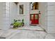 The main entry features double doors with glass detail, and professional landscaping including potted plants at 1214 Weatherstone Way, Peachtree City, GA 30269