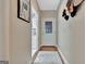 Hallway view showcasing white trim and doors leading to kitchen area at 1214 Weatherstone Way, Peachtree City, GA 30269