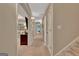Bright hallway with neutral paint leads to different areas of the home at 1214 Weatherstone Way, Peachtree City, GA 30269