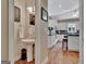 Bright kitchen view showcasing white cabinetry and stainless steel appliances with hardwood flooring at 1214 Weatherstone Way, Peachtree City, GA 30269