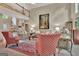 Spacious living room with a fireplace, tall ceilings, and stylish décor, creating an inviting atmosphere at 1214 Weatherstone Way, Peachtree City, GA 30269