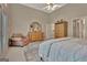 Spacious main bedroom with sitting area, dresser, and doorway to the hall at 1214 Weatherstone Way, Peachtree City, GA 30269