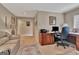 Spacious office area with a wooden desk and comfortable seating at 1214 Weatherstone Way, Peachtree City, GA 30269
