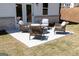Backyard patio area with outdoor seating and a fire pit, ideal for relaxation at 608 Belshire Dr, Acworth, GA 30102