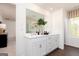 Bright bathroom with a double sink vanity, large mirror, and modern finishes at 608 Belshire Dr, Acworth, GA 30102