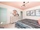 Bedroom featuring a decorative dresser, contemporary lighting, and a modern aesthetic at 608 Belshire Dr, Acworth, GA 30102