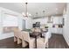 The dining area has a contemporary light fixture and shares an open concept with the kitchen at 608 Belshire Dr, Acworth, GA 30102